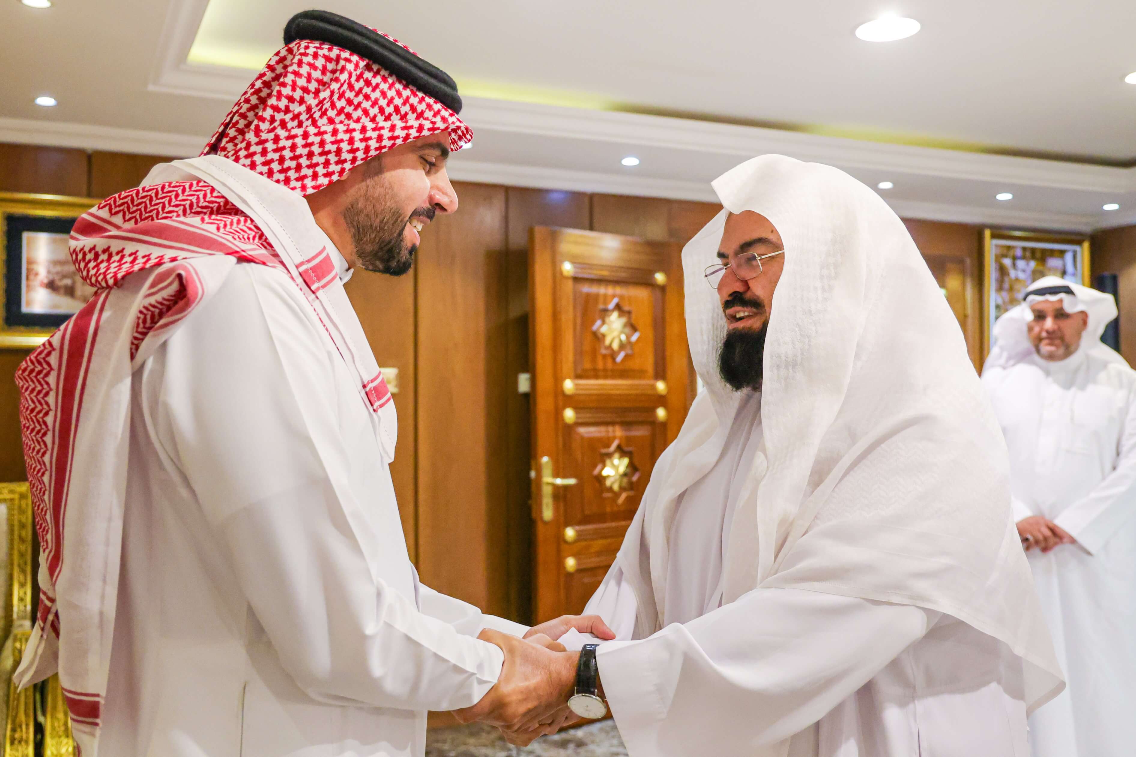 His Excellency Eng. Ahmed Alsuwaiyan greeting Dr. Abdulrahman Alsudais
