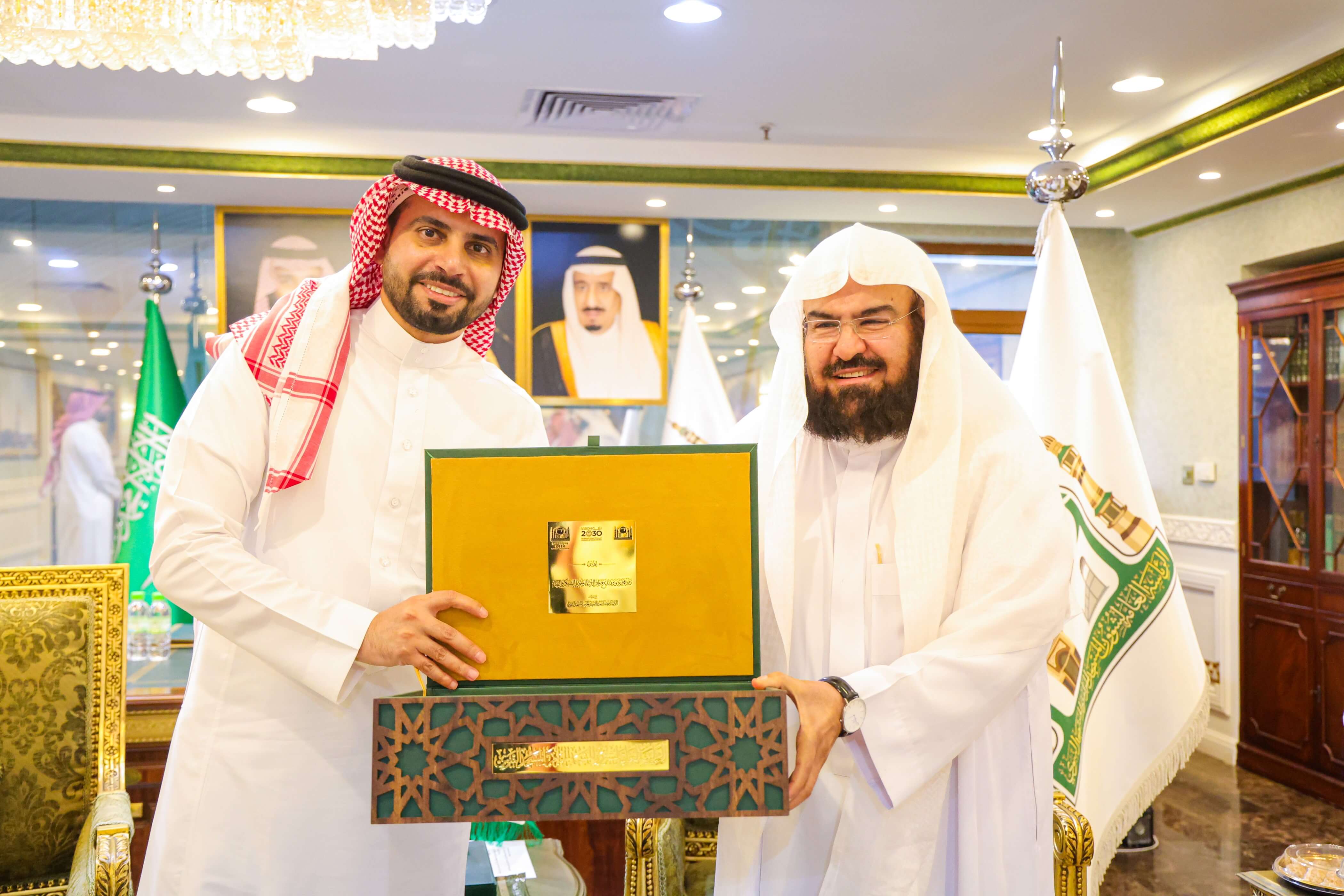 His Excellency Eng. Ahmed Alsuwaiyan greeting Dr. Abdulrahman Alsudais